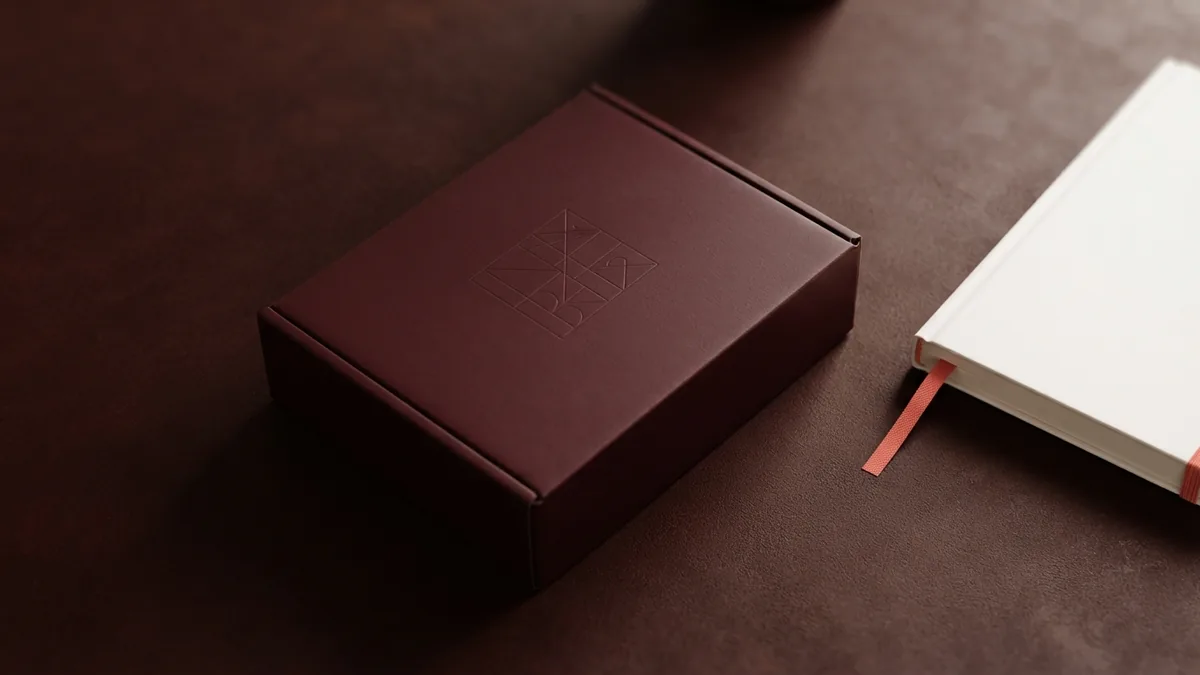 Create helpful product recommendations Product box and blank notebook arranged for an honest affiliate review